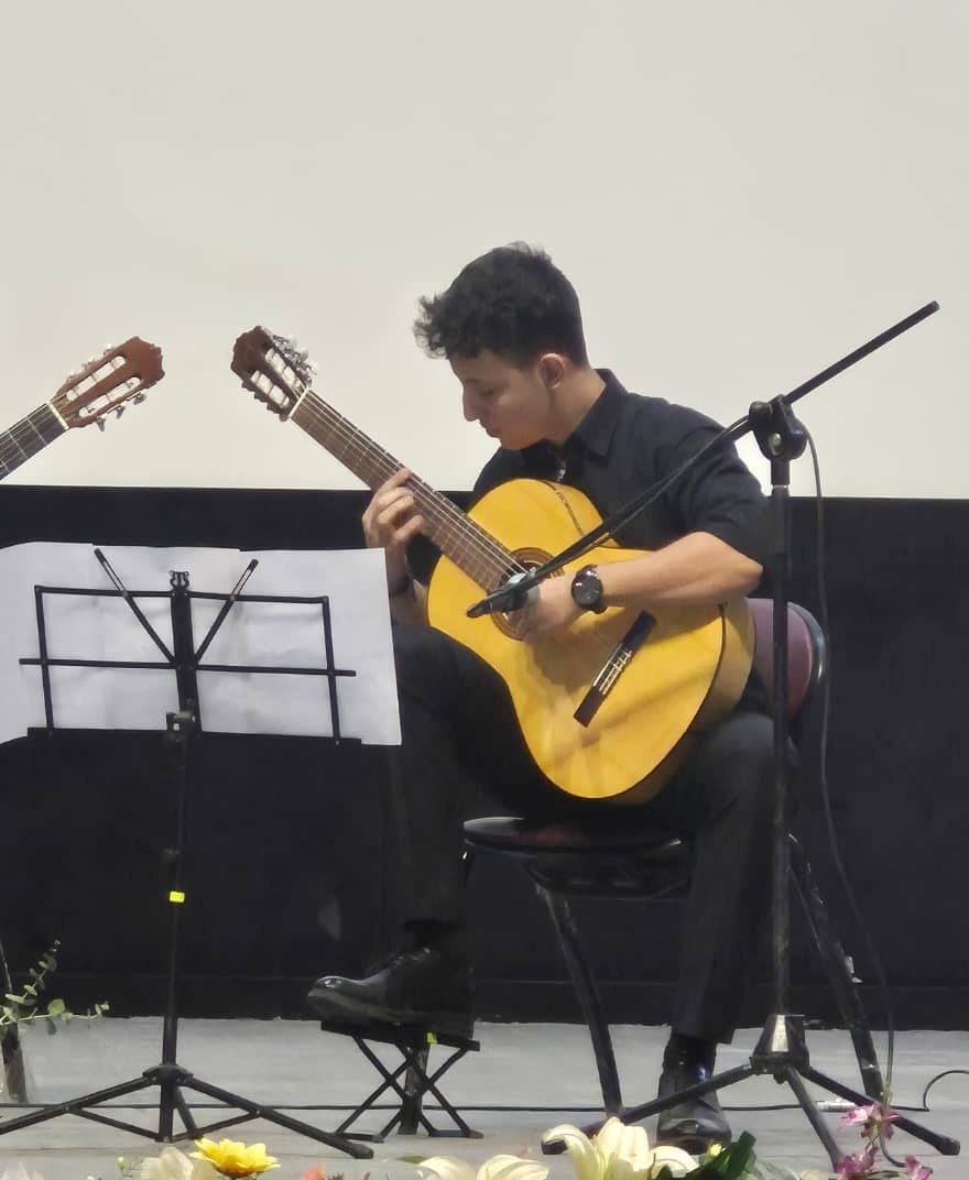 Arash Farahmand performing on stage